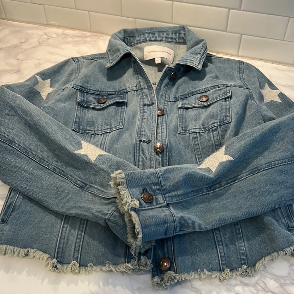 Cropped Jean Jacket with stars on sleeve.